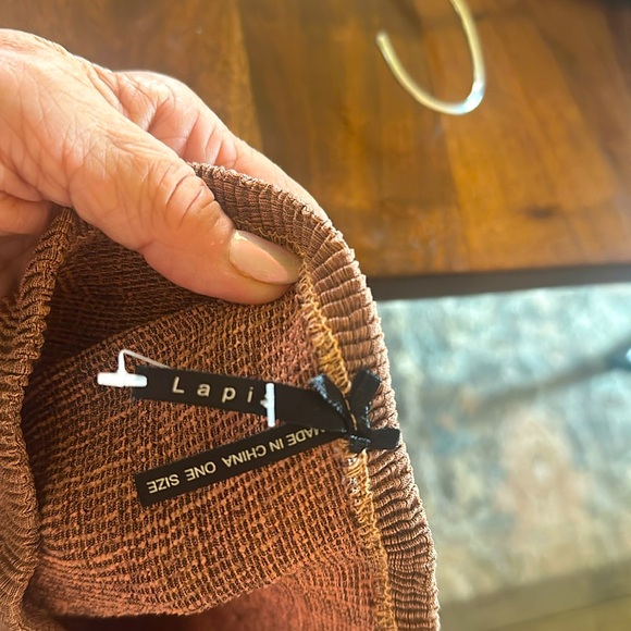 Beautiful boutique’s skirt. Gorgeous salmon and brown . Looks like silk. - Picture 4 of 5